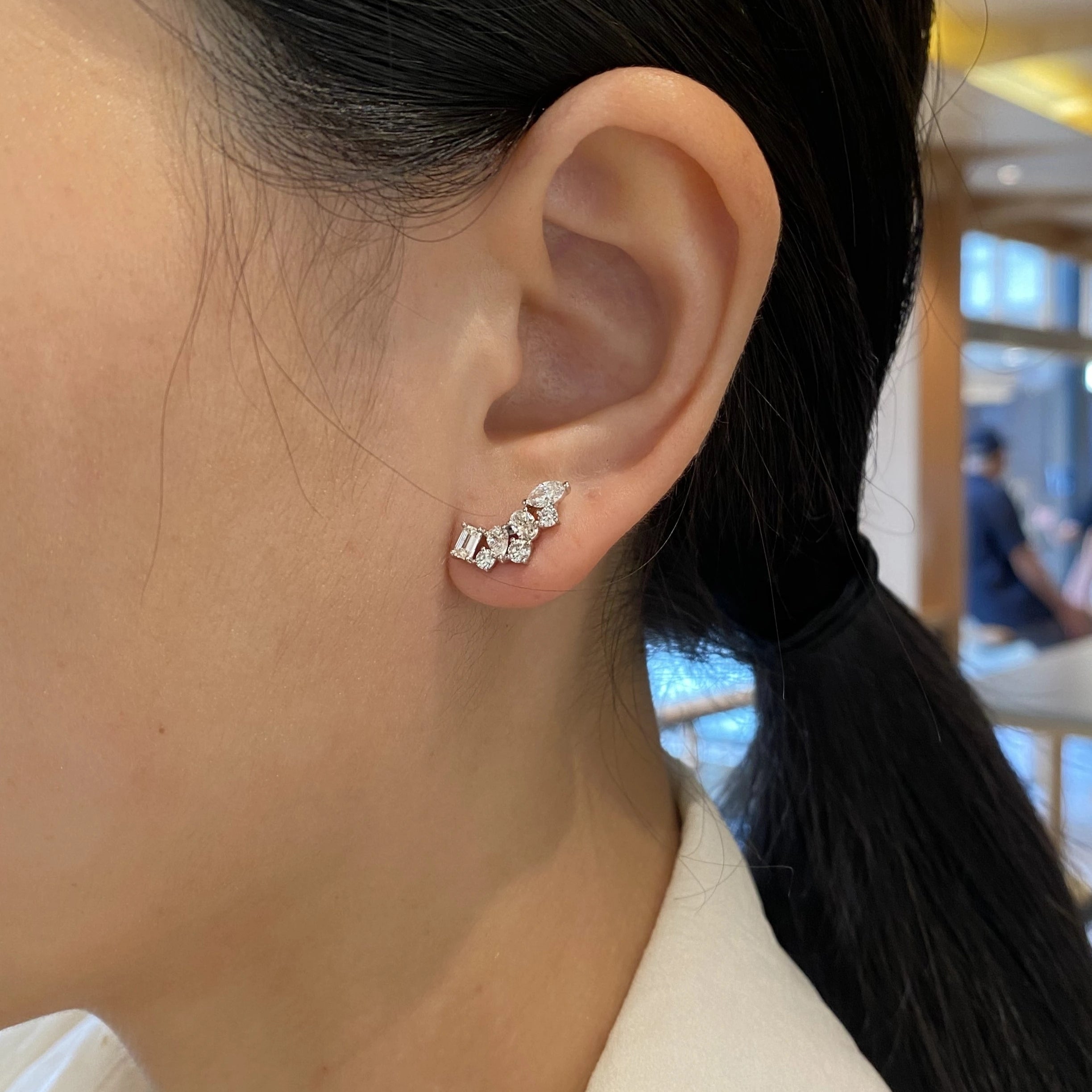 Close-up of an ear wearing a diamond climber