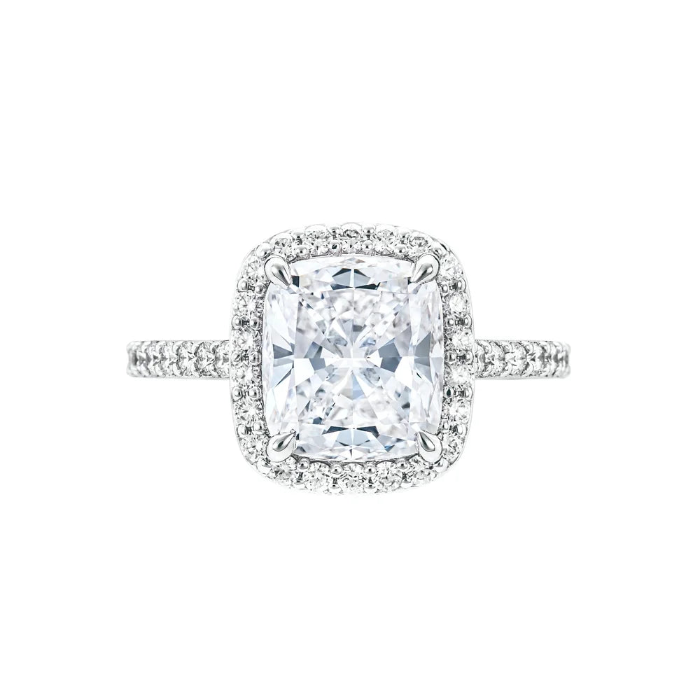 High res elongated cushion diamond ring with halo in white background