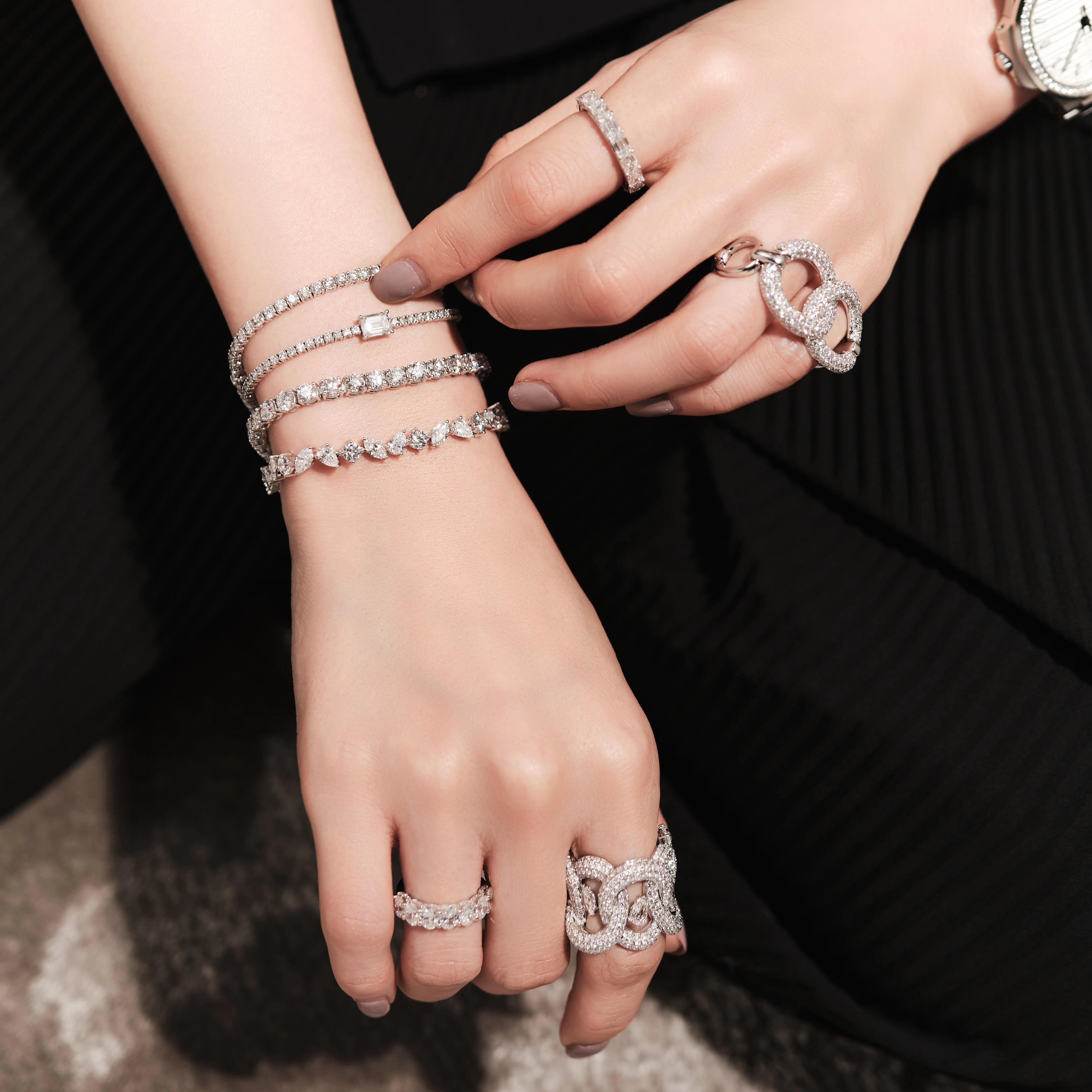 Tennis Bracelet with Emerald Diamond Center Stone