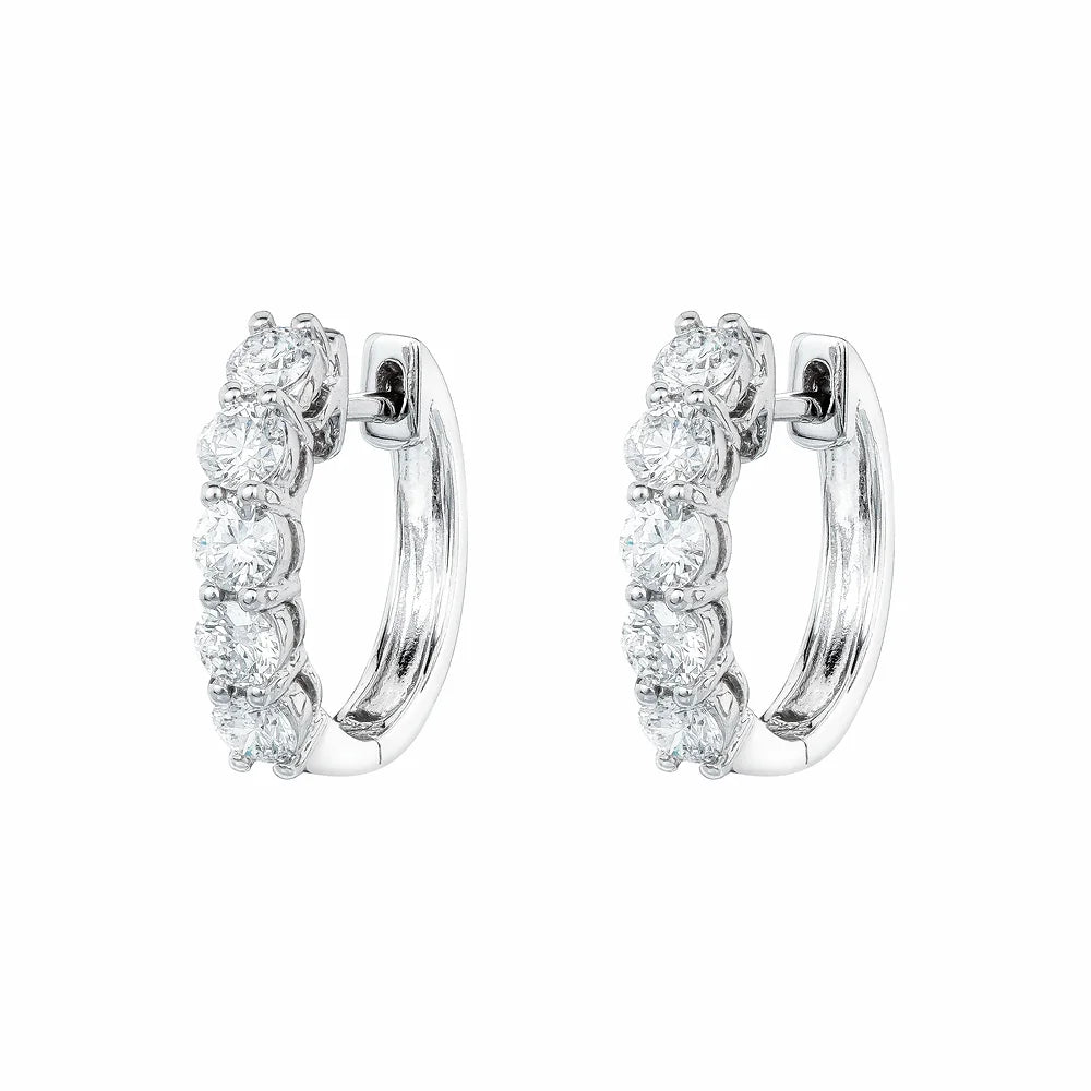White gold Diamond Huggies on white background.