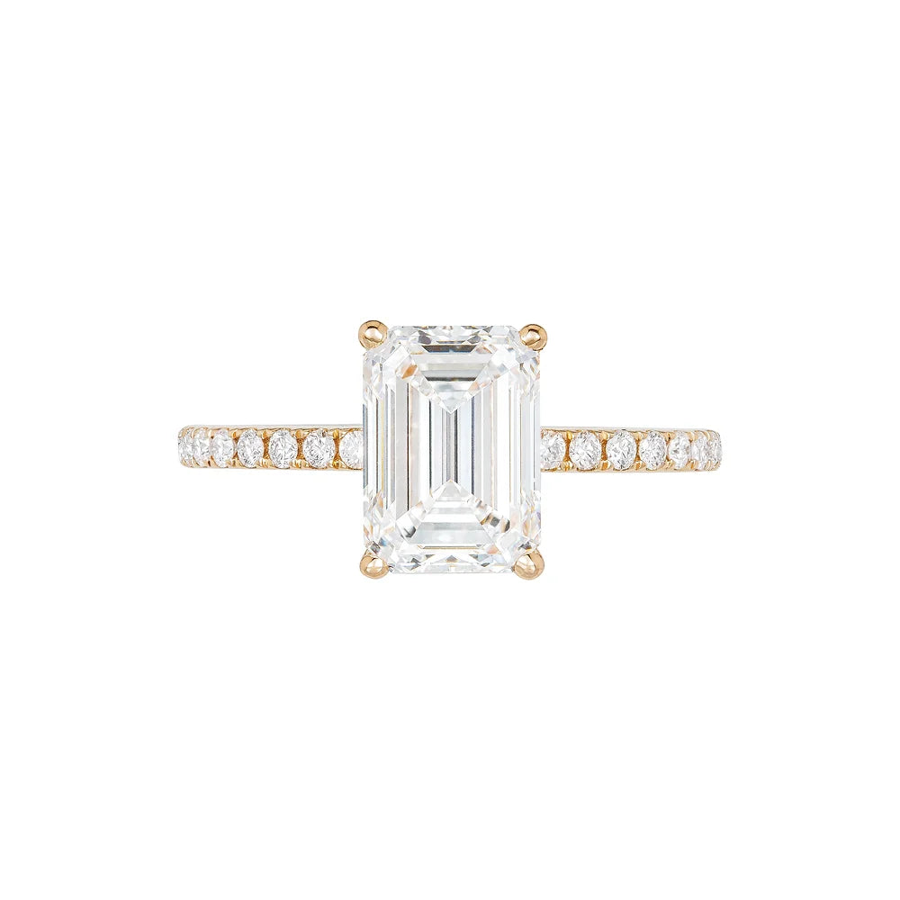 Rose gold Emerald Cut Engagement Ring on white background.