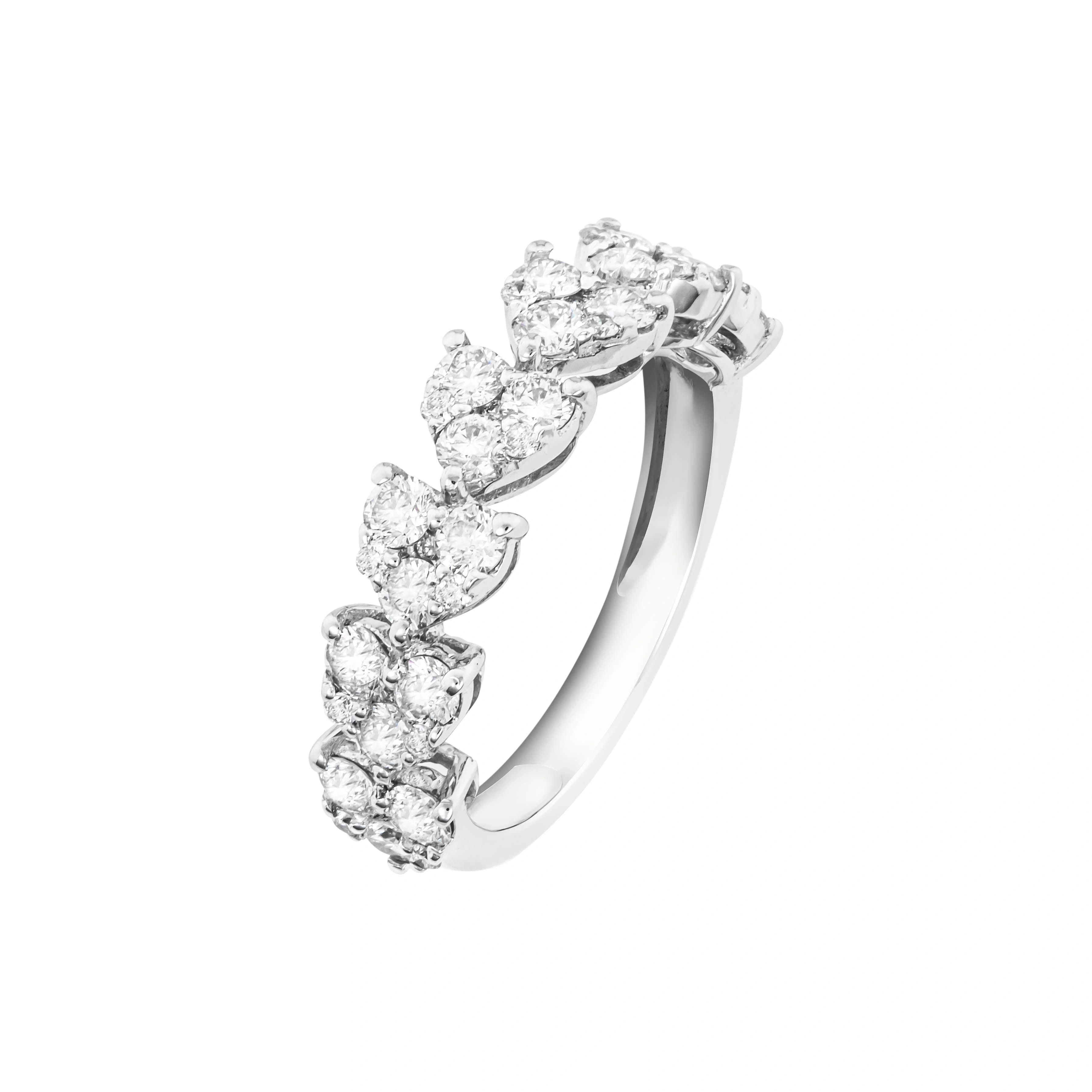 White gold eternity ring with heart-shaped diamond stones on white background