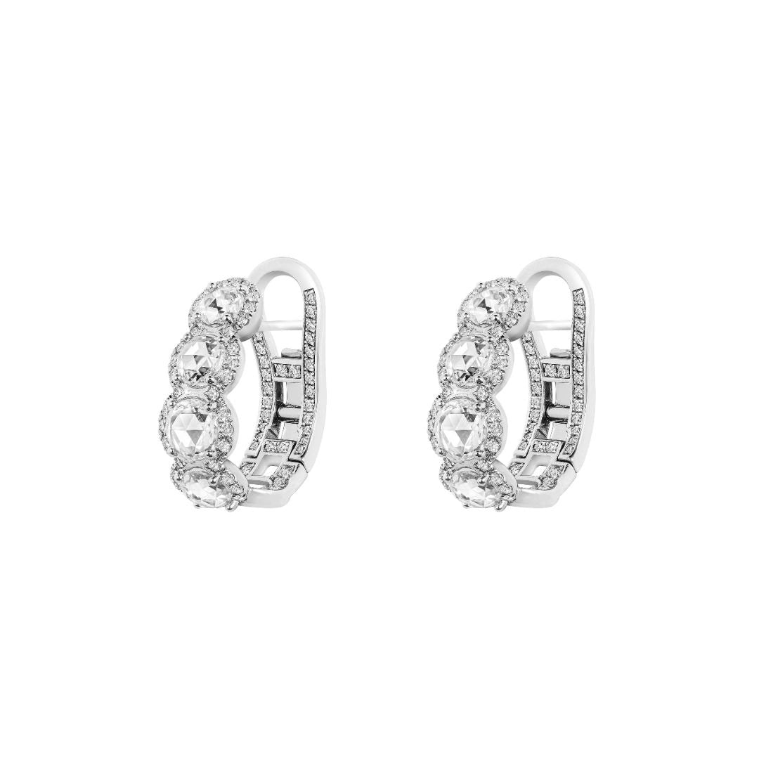 Pair of rose cut diamond hoop earrings on white background