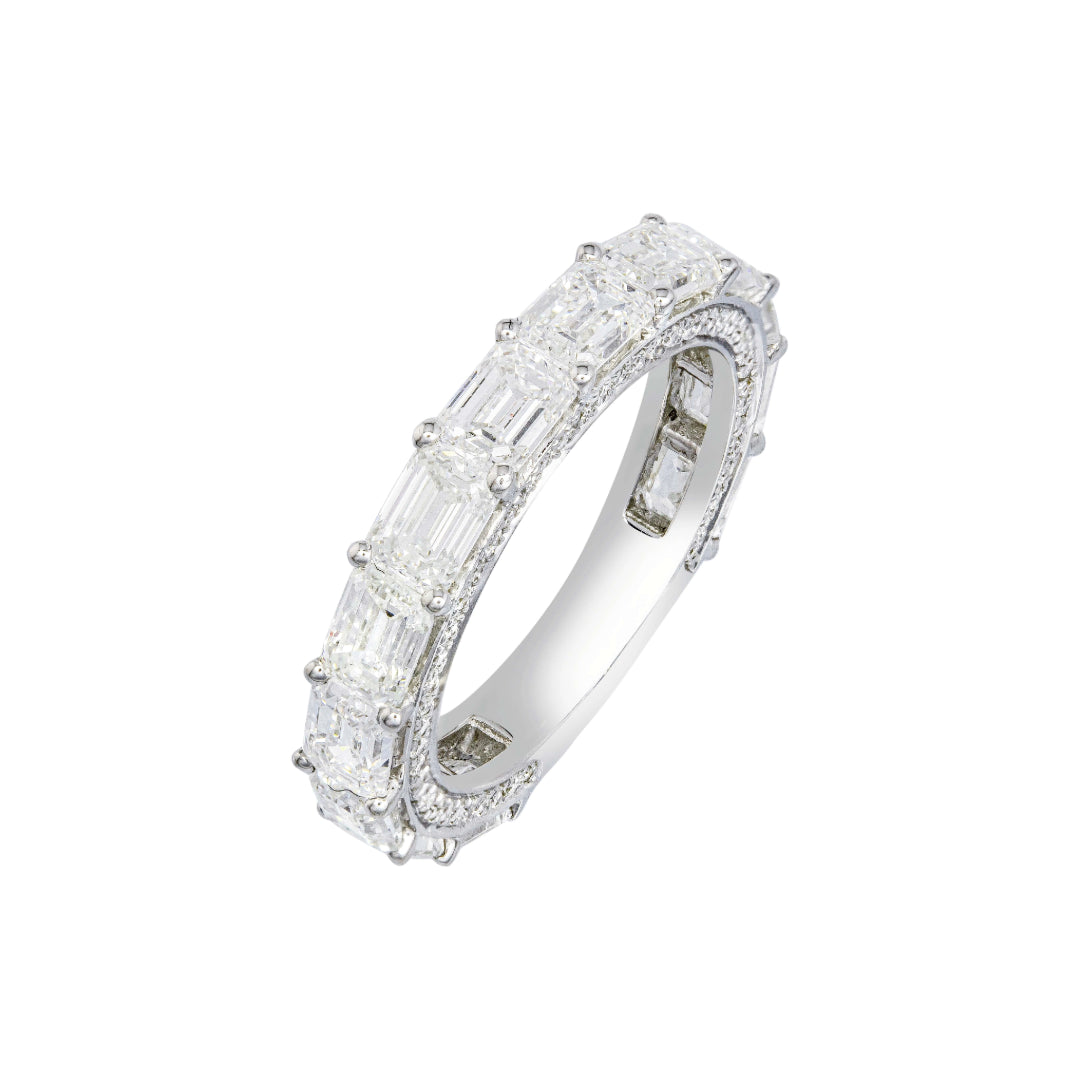 White gold diamond ring with baguette and round cut diamonds on a white background