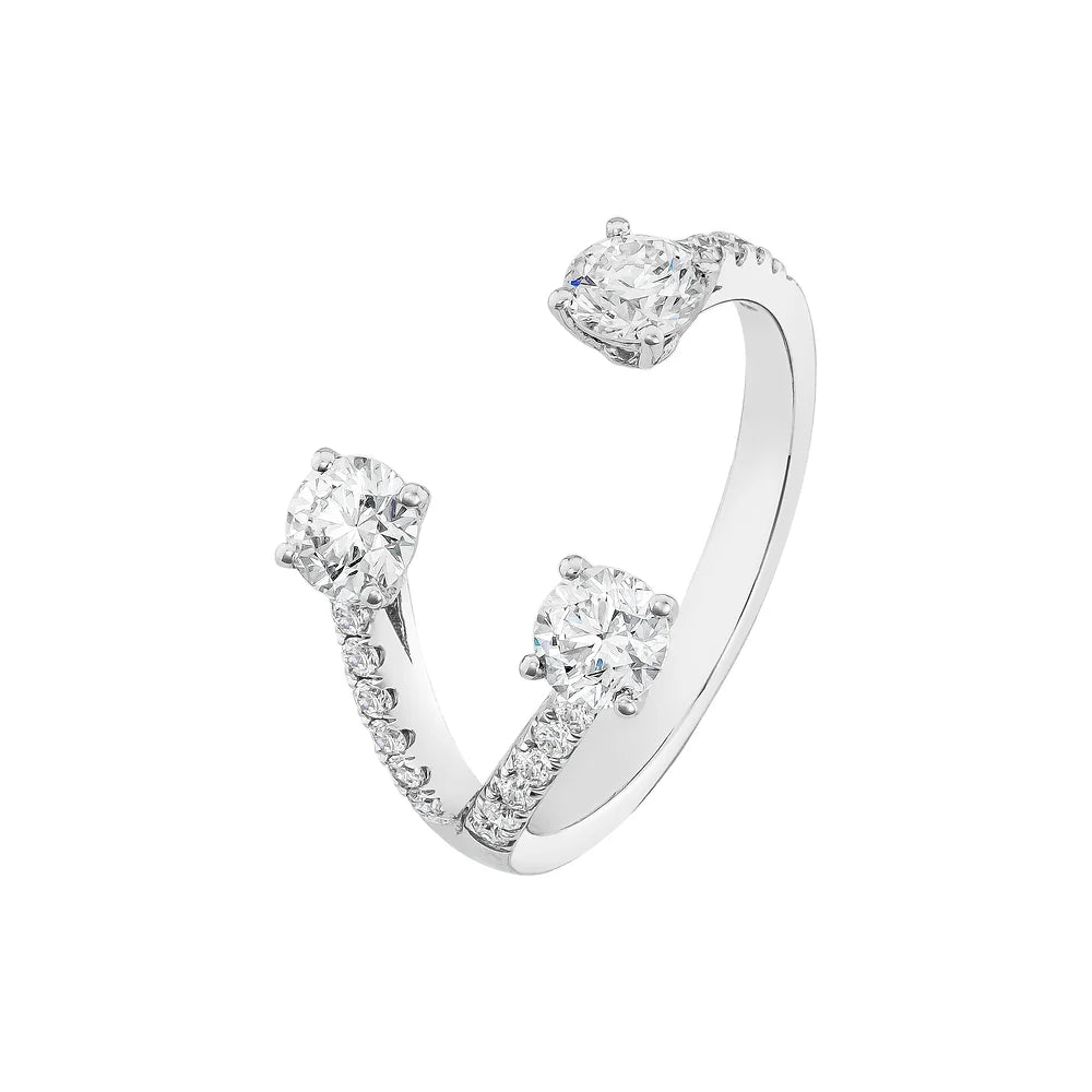 Three round diamonds in open ring design that wraps around finger